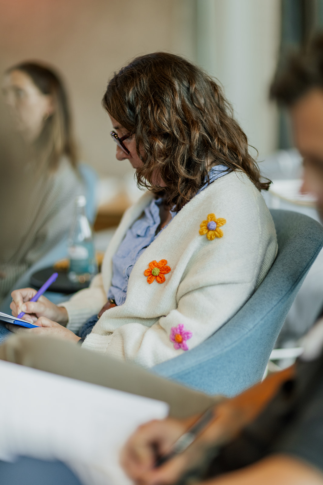 Participant taking notes during a coaching session